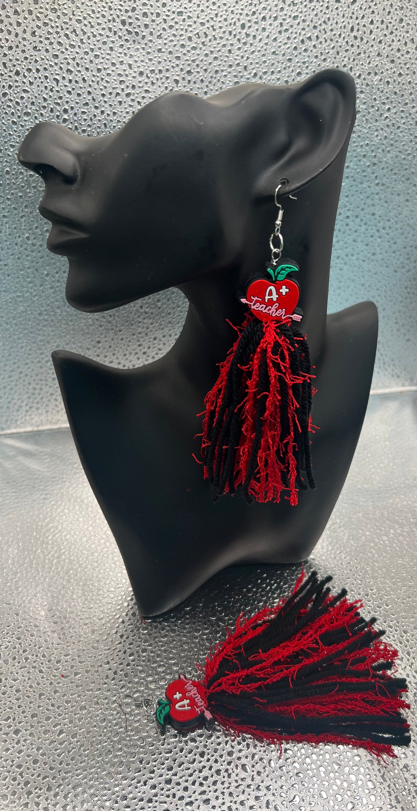 #571-4 Apple topper with black yarn & red fringe with silver hook, earrings