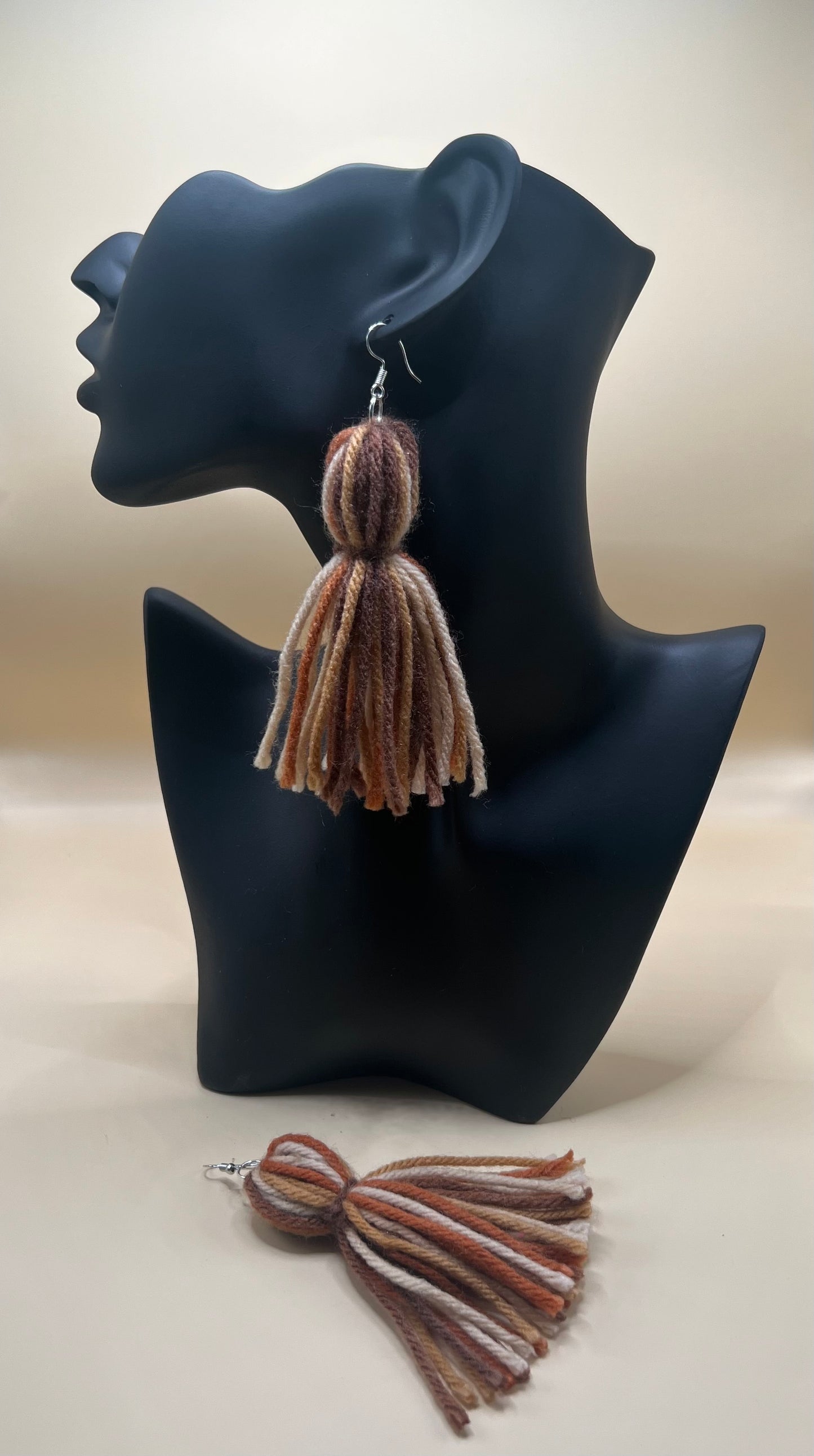 #21 Tassel Me, Honnee Blended tan, beige and brown with pompom