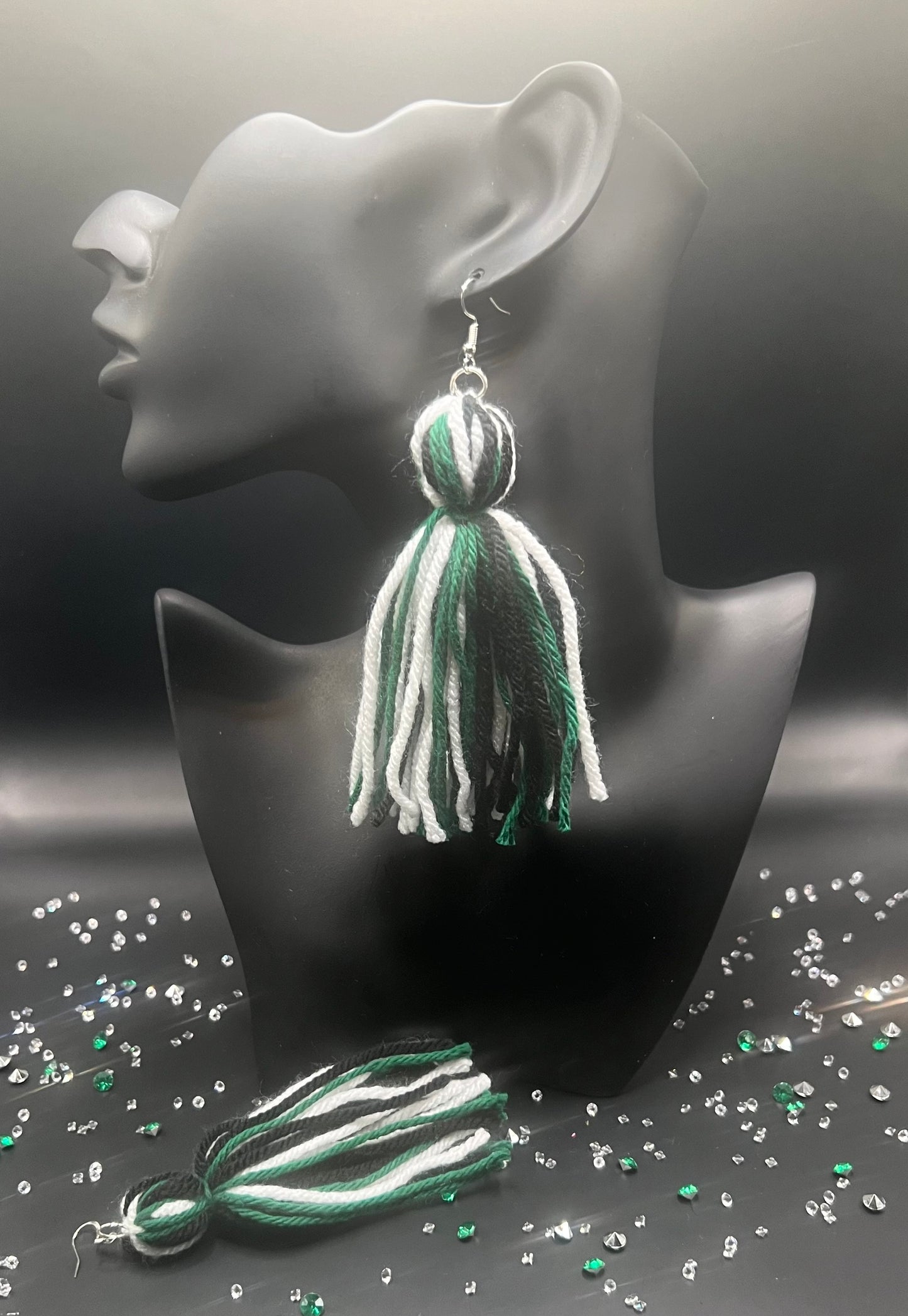 #18 Tassel Me, Honnee Black, green and white with pom