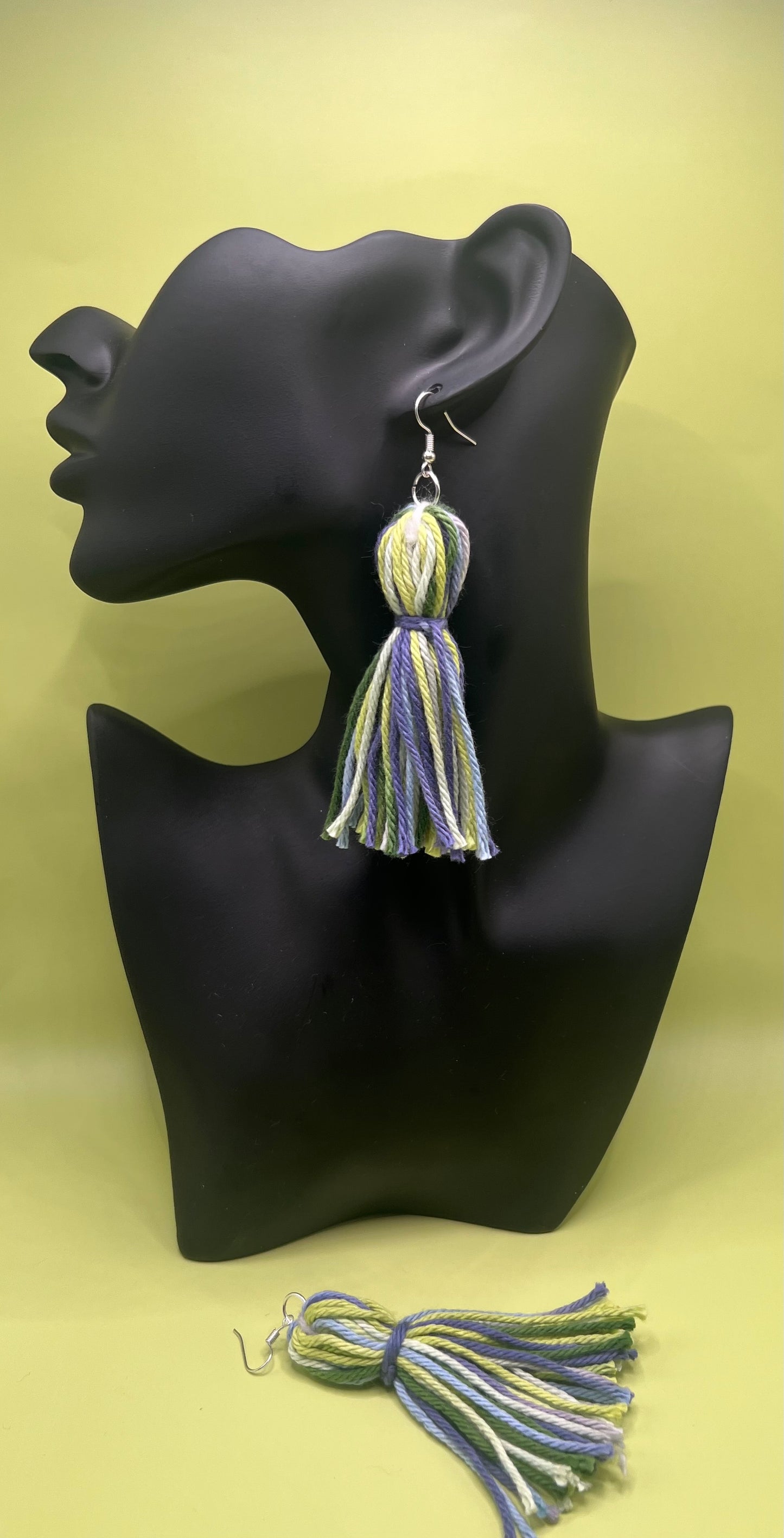 #17 Tassel Me, Honnee Multi colored lime, baby blueand light grey with pom