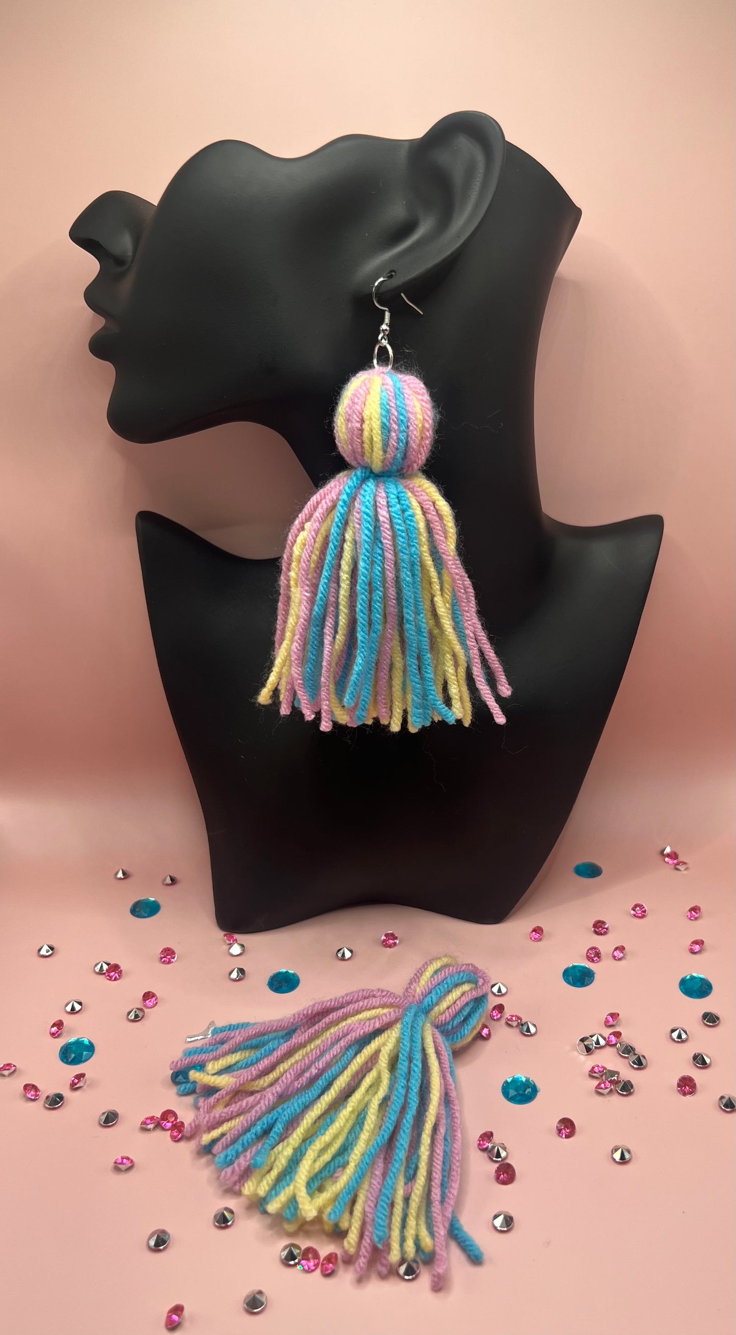 #15 Tassel Me, Honnee Pastel pink, light blue and yellow with pom