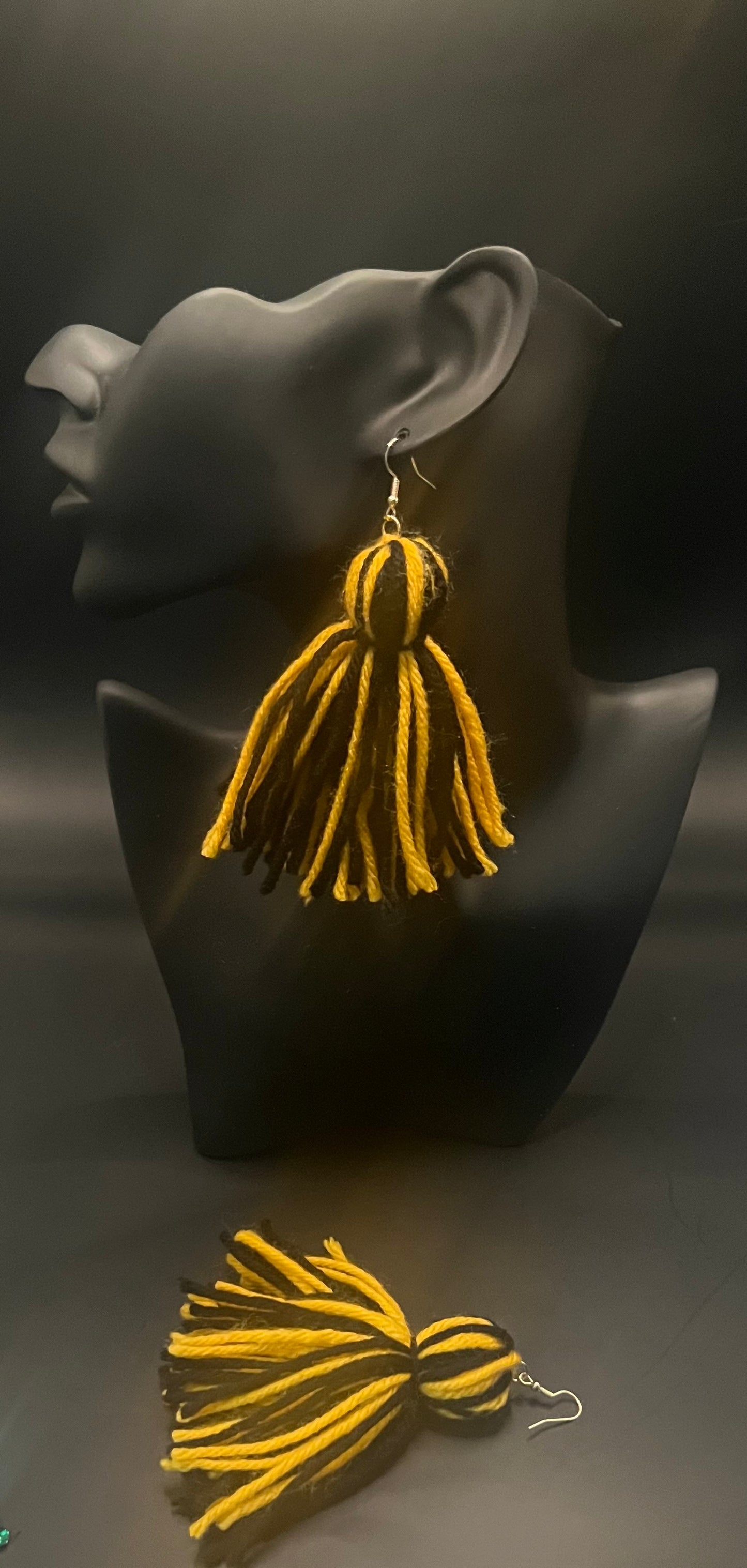 #16 Tassel Me, Honnee Yellow and black with pom
