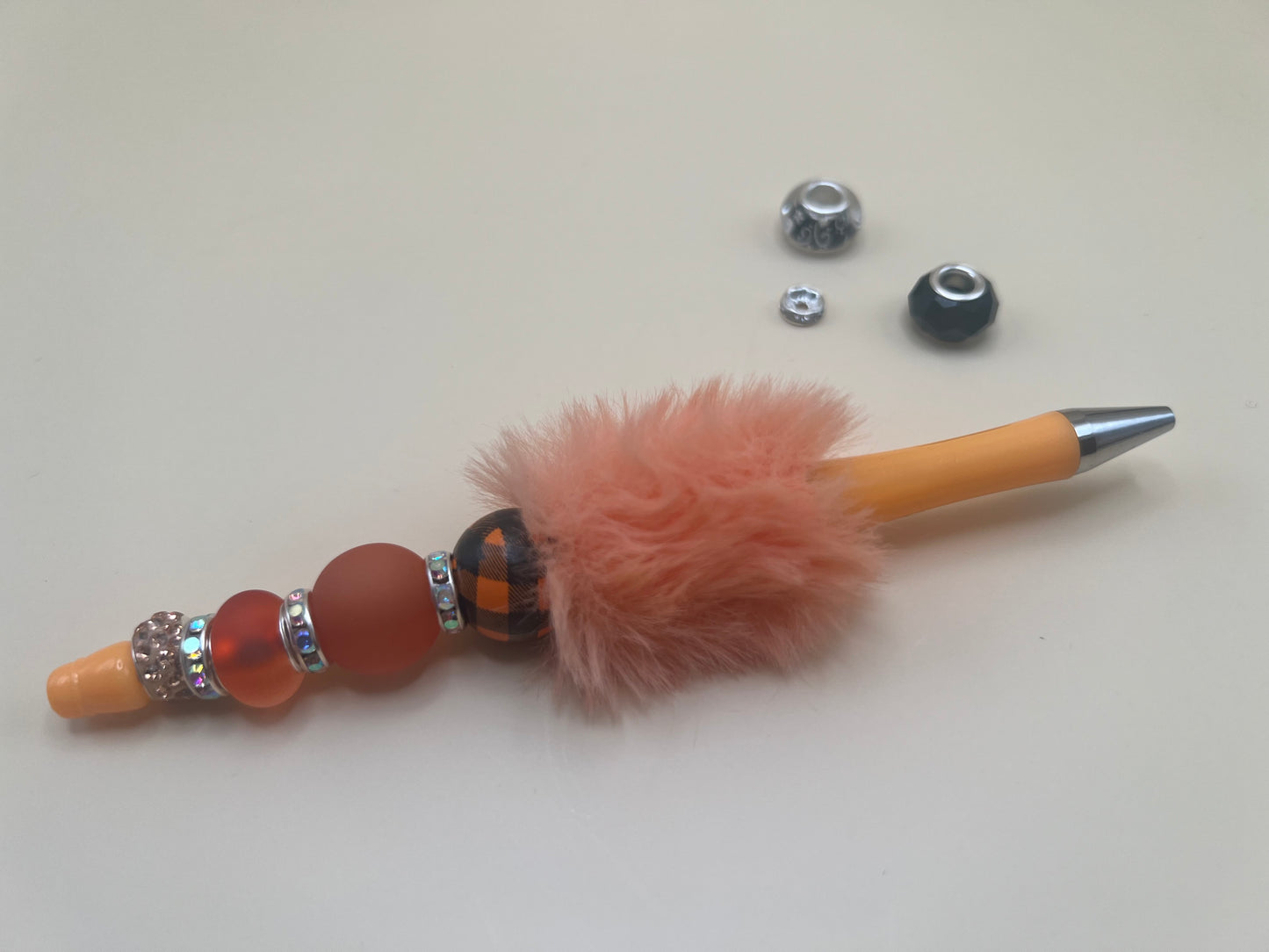 2435-2 orange with peachy orange pom with orange and black & orange balls